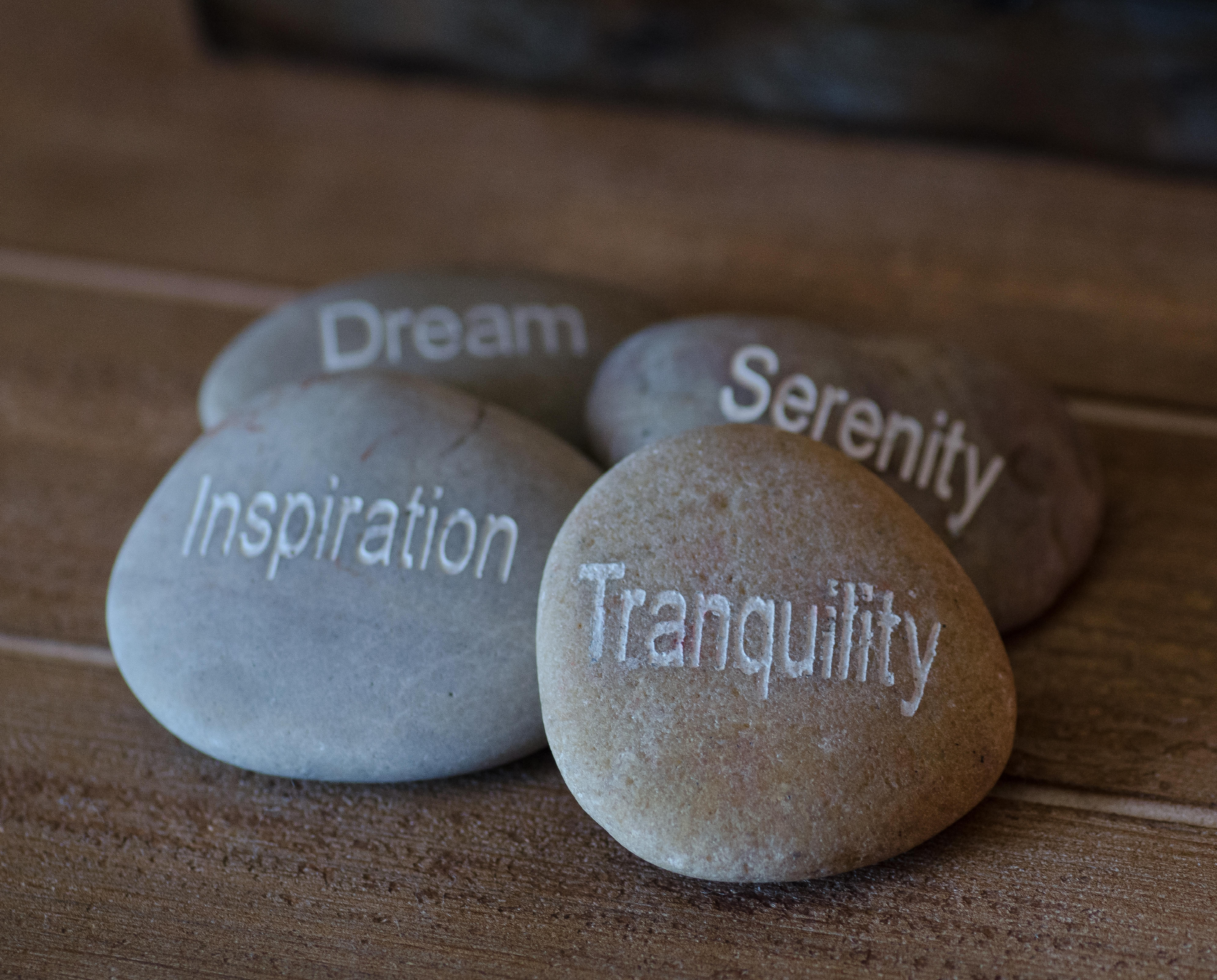 Massage stones with words Dream, Serenity, Inspiration, Tranquility